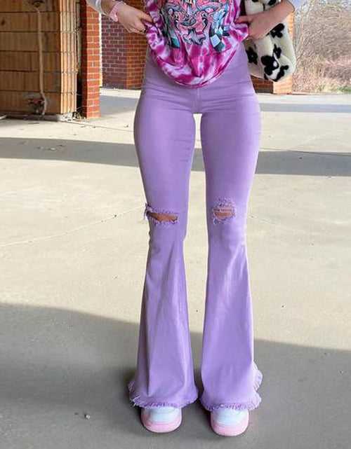 Load image into Gallery viewer, Effortlessly Edgy: Colored Stretch Denim Trousers with Ripped Frayed Flared Hem - Elevate Your Look with Trendy Distressed Details Purple
