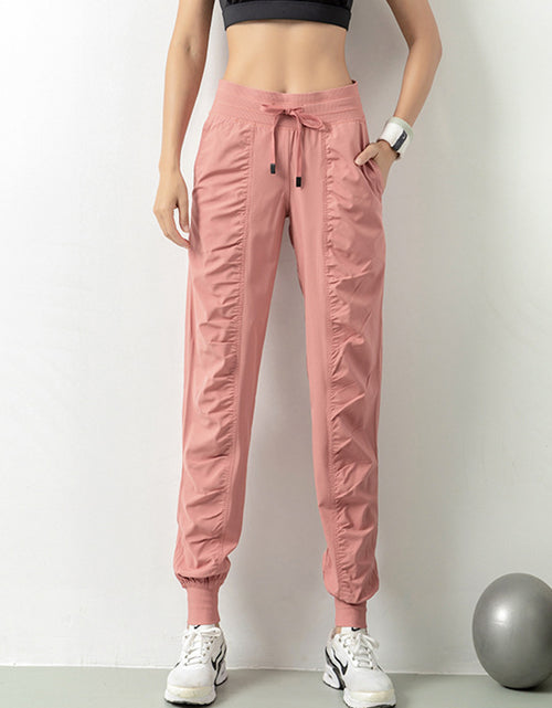 Load image into Gallery viewer, Stay Active in Comfort: Women&#39;s Casual Sports Pants with Loose Legs, Drawstring High Waist, and Pockets - Perfect for Running, Gym, and Yoga Fitness Pink
