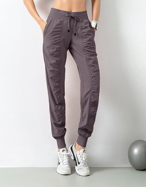 Load image into Gallery viewer, Stay Active in Comfort: Women&#39;s Casual Sports Pants with Loose Legs, Drawstring High Waist, and Pockets - Perfect for Running, Gym, and Yoga Fitness Purple
