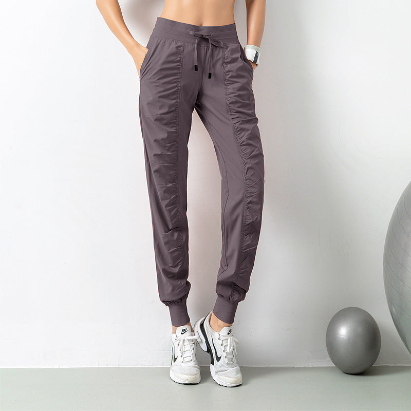 Stay Active in Comfort: Women's Casual Sports Pants with Loose Legs, Drawstring High Waist, and Pockets - Perfect for Running, Gym, and Yoga Fitness Purple