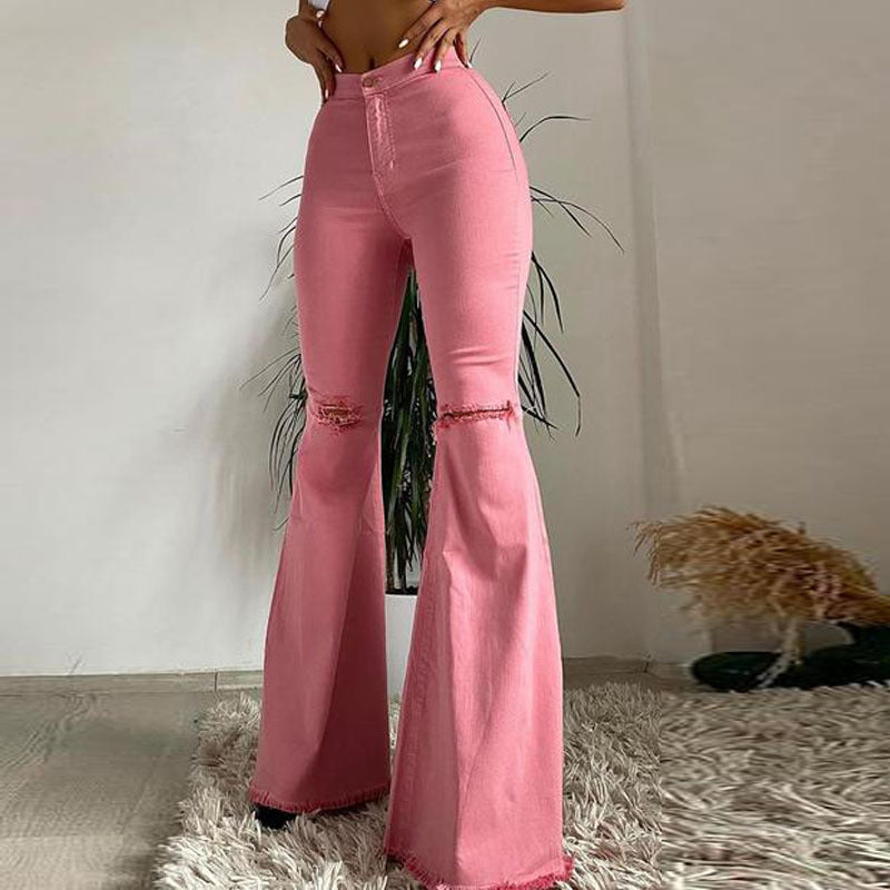 Effortlessly Edgy: Colored Stretch Denim Trousers with Ripped Frayed Flared Hem - Elevate Your Look with Trendy Distressed Details Pink