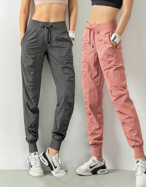 Load image into Gallery viewer, Stay Active in Comfort: Women&#39;s Casual Sports Pants with Loose Legs, Drawstring High Waist, and Pockets - Perfect for Running, Gym, and Yoga Fitness
