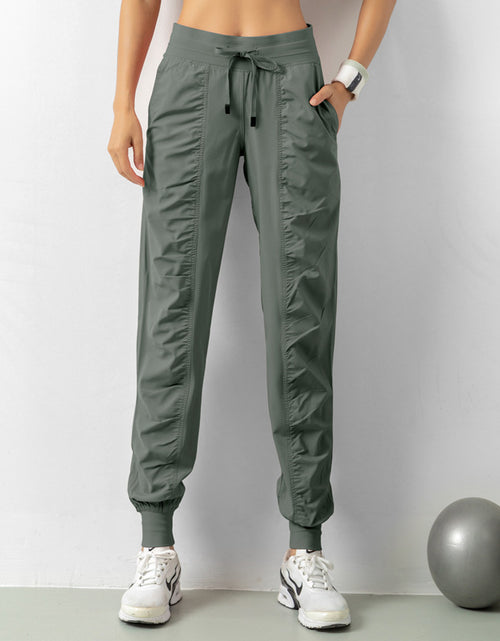 Load image into Gallery viewer, Stay Active in Comfort: Women&#39;s Casual Sports Pants with Loose Legs, Drawstring High Waist, and Pockets - Perfect for Running, Gym, and Yoga Fitness
