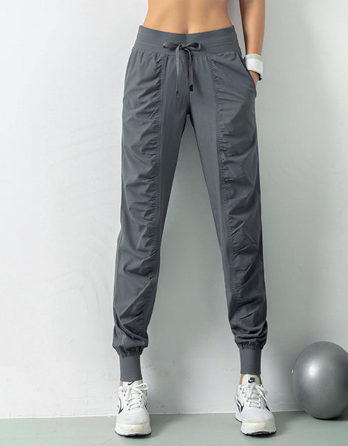 Load image into Gallery viewer, Stay Active in Comfort: Women&#39;s Casual Sports Pants with Loose Legs, Drawstring High Waist, and Pockets - Perfect for Running, Gym, and Yoga Fitness
