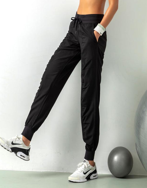 Load image into Gallery viewer, Stay Active in Comfort: Women&#39;s Casual Sports Pants with Loose Legs, Drawstring High Waist, and Pockets - Perfect for Running, Gym, and Yoga Fitness Black
